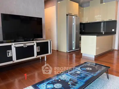 Modern open-plan living room with sleek kitchen and stylish decor