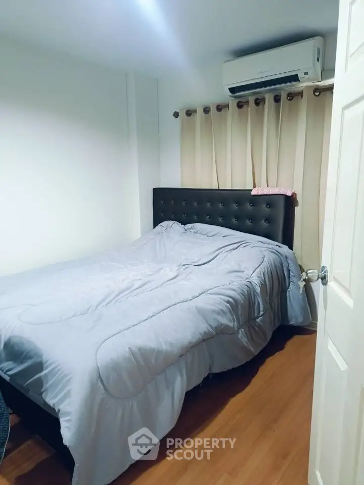 Cozy bedroom with modern air conditioning and elegant decor