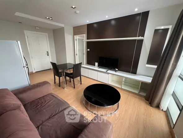 Modern living room with sleek furniture and natural light, perfect for urban living.