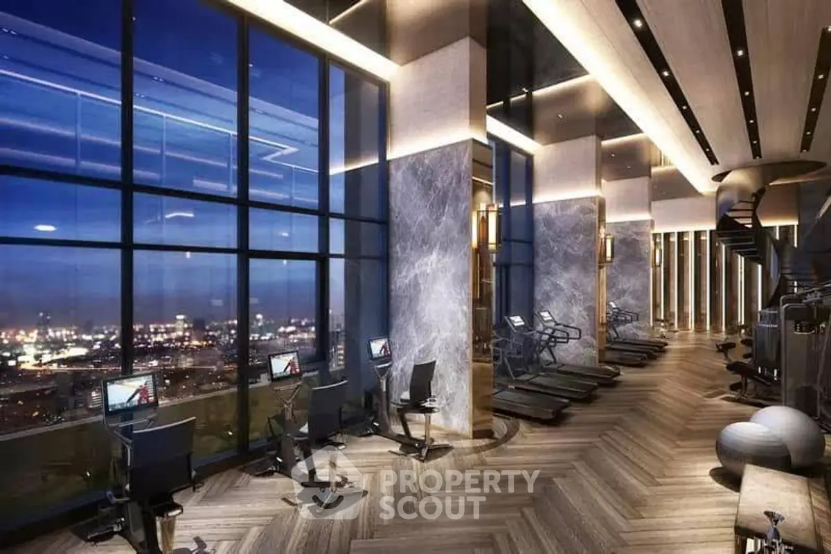 Luxurious high-rise gym with panoramic city views and modern equipment.