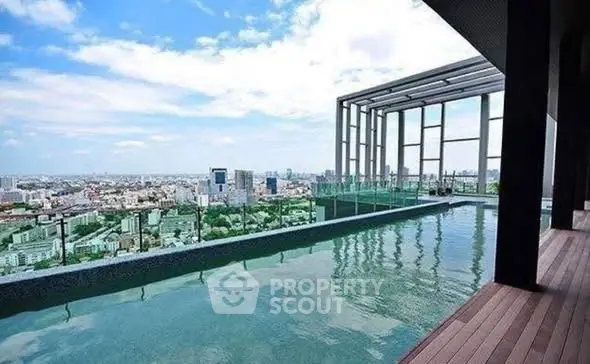 Luxurious rooftop pool with stunning city skyline view, perfect for relaxation and entertainment.