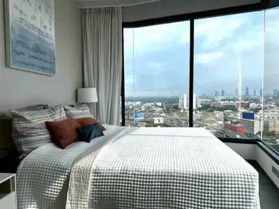 Luxurious bedroom with panoramic city view and modern decor