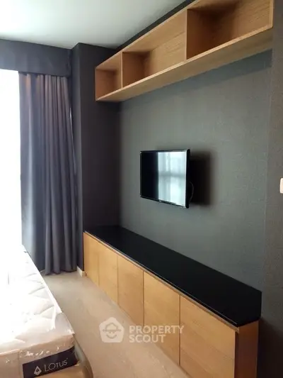 Modern living room with sleek TV unit and stylish shelving