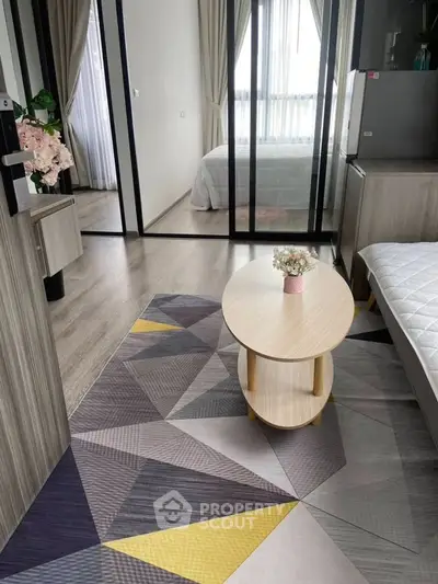 Modern studio apartment with stylish decor and glass partition