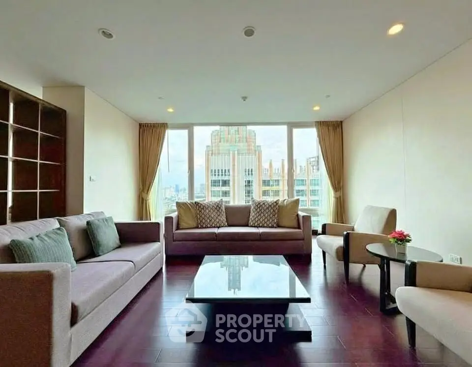 Spacious living room with modern furniture and city view