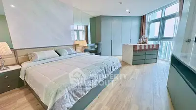 Luxurious modern bedroom with large windows and elegant decor