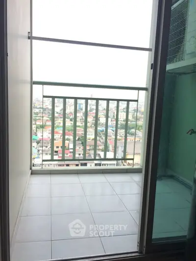 Charming balcony with panoramic city view, perfect for relaxation and enjoying urban scenery.