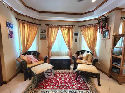 Charming living room with elegant decor, cozy seating, and warm lighting, perfect for relaxation and entertaining.