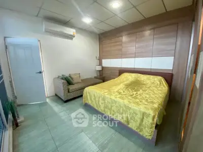 Cozy bedroom with modern decor and ample storage space