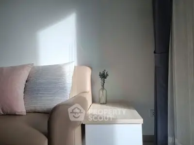 Cozy living room corner with stylish sofa and elegant side table