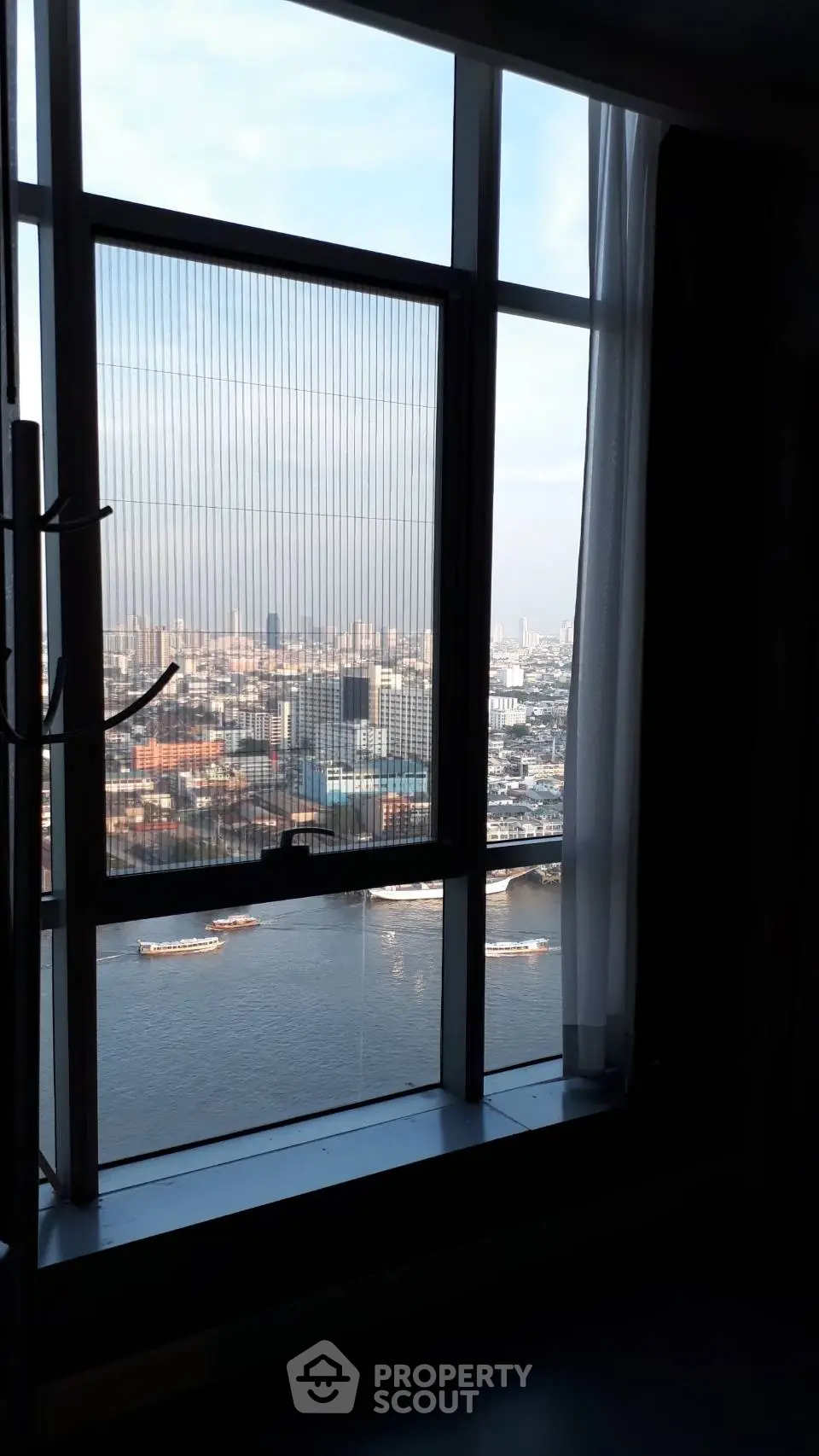 Stunning high-rise city view from a modern apartment window