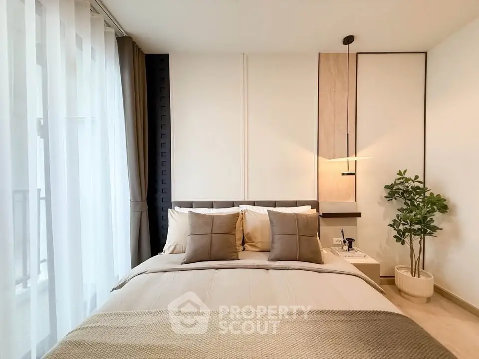 Modern bedroom with stylish decor and natural light