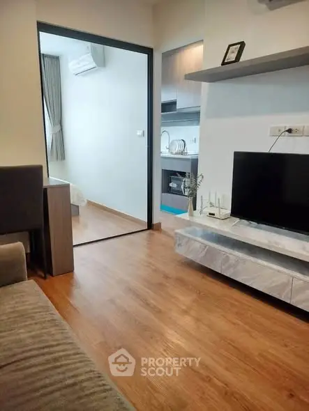 Modern apartment interior with cozy living room and open kitchen layout