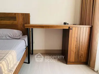 Cozy bedroom with wooden furniture and natural light