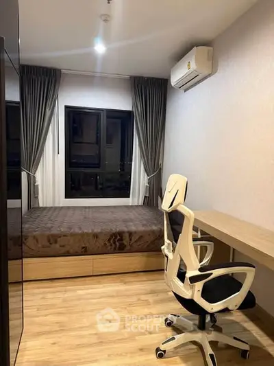 Modern bedroom with stylish furniture and natural light, perfect for a cozy living experience.