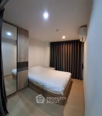 Modern bedroom with cozy lighting and sleek wooden furniture