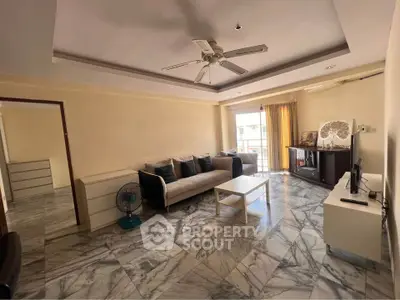 Spacious living room with marble flooring and modern furniture in a bright apartment