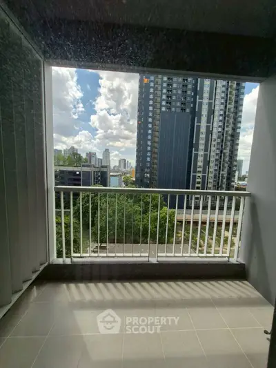 Spacious balcony with stunning city view in modern high-rise apartment
