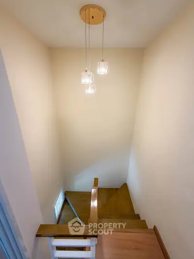 Elegant staircase with modern lighting in a cozy home interior