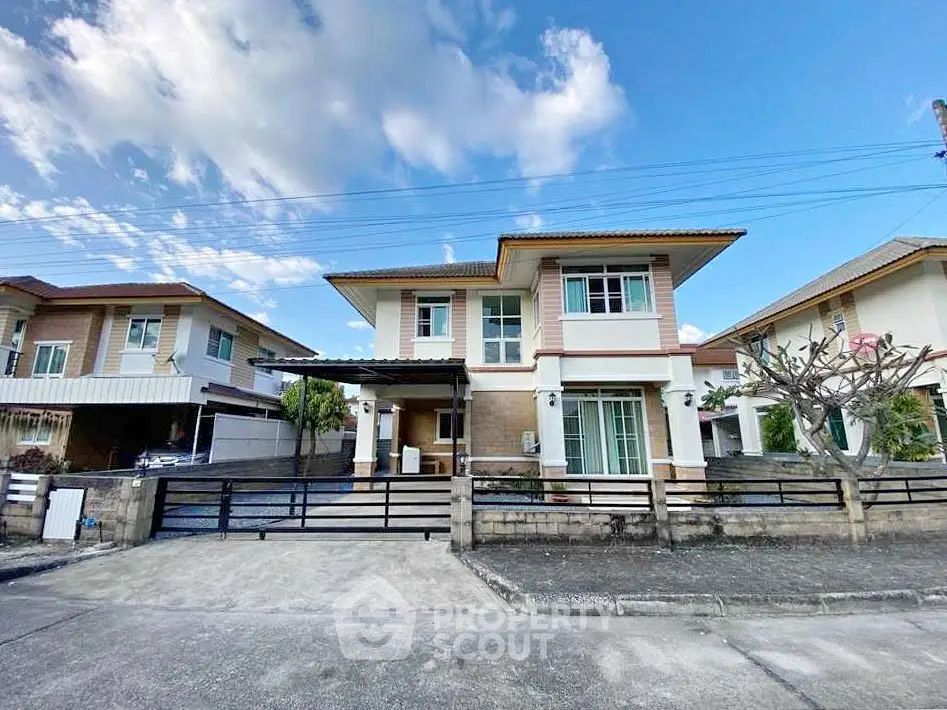 Charming two-story suburban house with modern design and spacious driveway in a peaceful neighborhood.