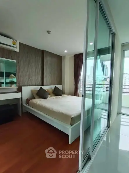 Modern bedroom with balcony view in urban apartment