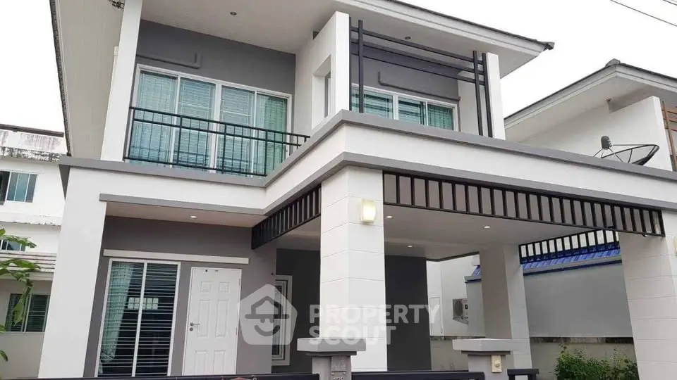 Modern two-story house with sleek design and large windows