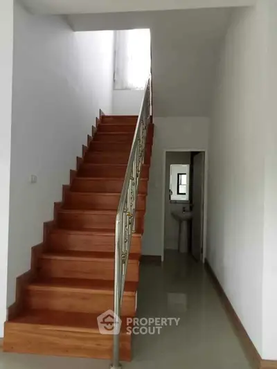 Elegant wooden staircase in modern home interior with sleek design