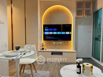 Modern living room with stylish TV setup and elegant dining area