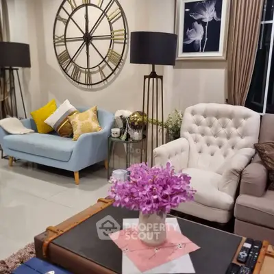Charming living room with elegant decor, plush seating, and stylish clock wall art for a cozy ambiance.