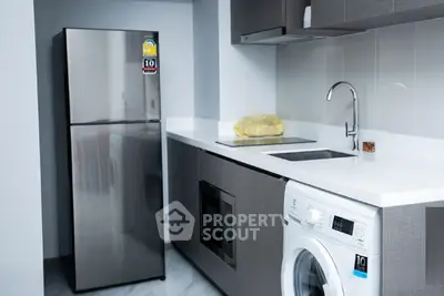 Modern kitchen with sleek appliances and stylish cabinetry