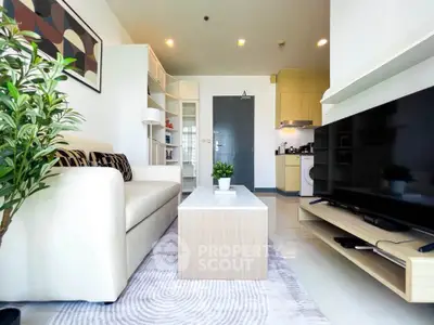 Modern living room with sleek furniture and open kitchen layout