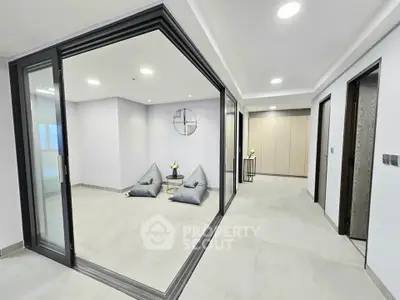 Spacious modern interior with sliding glass doors and minimalist decor