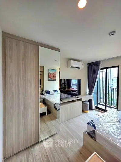 Modern bedroom with balcony access and stylish decor