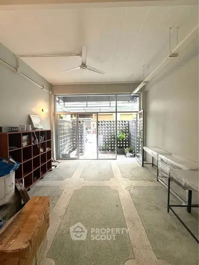 Spacious interior with large windows and modern design, perfect for versatile use.