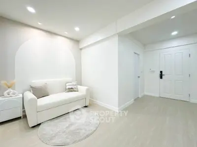 Modern minimalist living room with white sofa and stylish decor