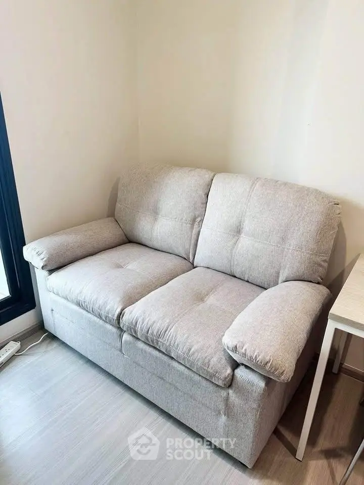 Cozy two-seater sofa in a modern living room with natural light.