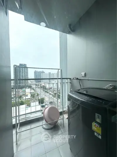 High-rise apartment balcony with city view and washing machine