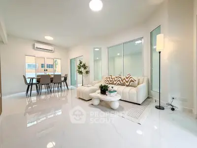Spacious modern living room with elegant dining area and stylish decor