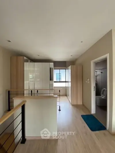 Modern open layout kitchen with sleek design and wooden flooring