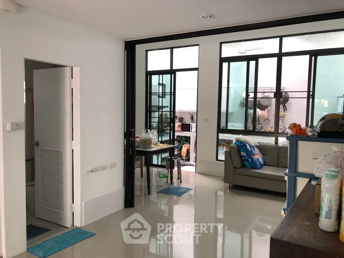 Spacious open-layout living area with modern kitchen and dining space