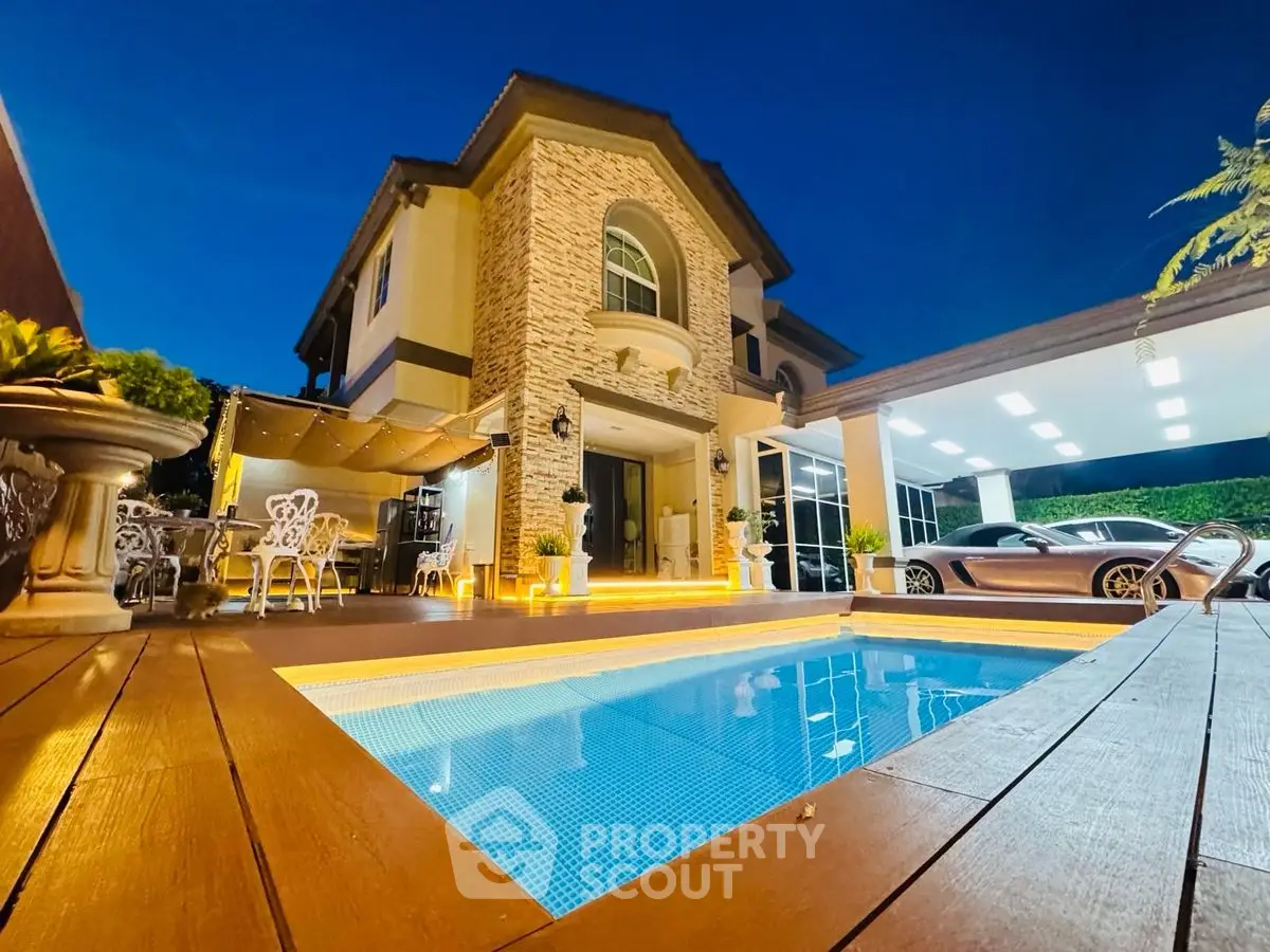 Luxurious villa with pool and elegant exterior lighting at dusk