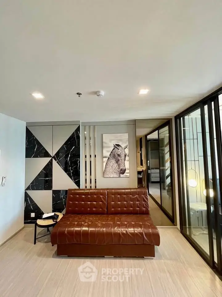 Modern living room with stylish decor and leather sofa in contemporary apartment