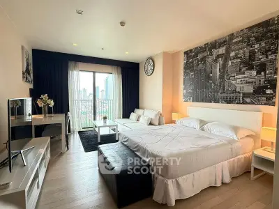 Spacious modern bedroom with city view, stylish decor, and natural light.