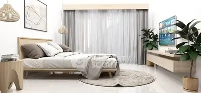 Modern bedroom with stylish decor, large window, and wall-mounted TV for ultimate comfort and relaxation.