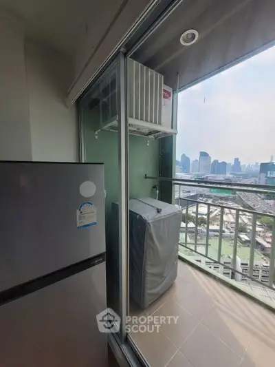 High-rise balcony with city view and air conditioning unit