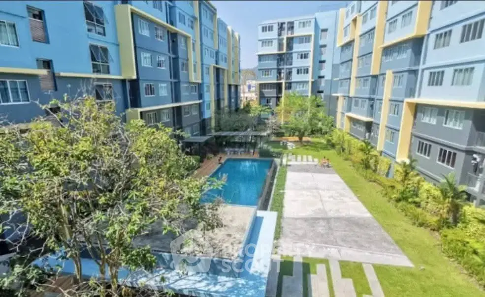 Modern apartment complex with pool and landscaped garden view