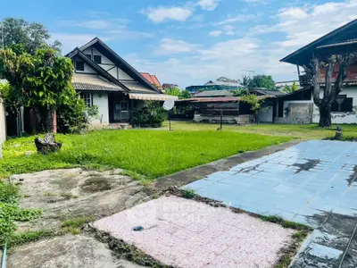 Charming suburban home with spacious backyard and lush green lawn, perfect for family gatherings and outdoor activities.