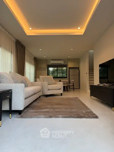 Modern living room with elegant lighting and cozy seating area