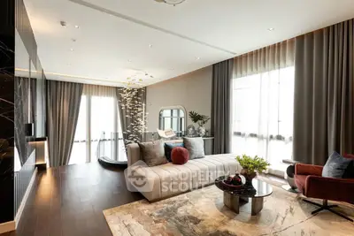 Luxurious modern living room with elegant decor and large windows