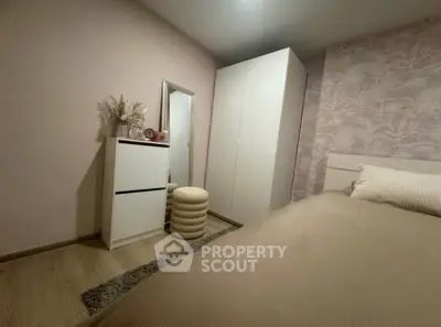 Cozy bedroom with modern decor and ample storage space